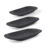 3  VARIOUS SIZED BLACK CARVED OVAL PAULOWNIA WOOD TRAYS